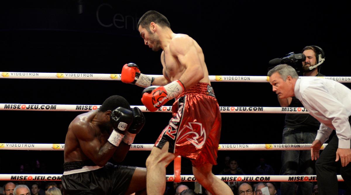 Sep 27, 2014; Montreal, Quebec, Canada; Artur Beterbiev (red trunks) and Tavoris Cloud (black trunks) box during the first round of their light heavyweight NABA championship fight at the Bell Centre.