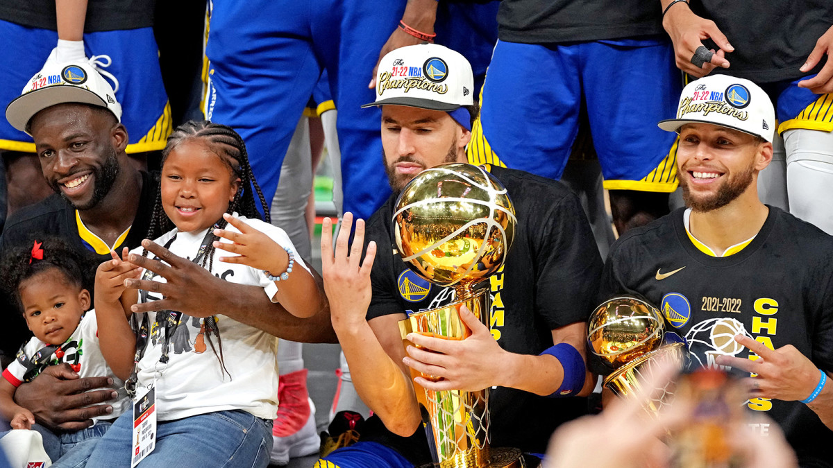 Golden State Warriors forward Draymond Green (23), guard Klay Thompson (11) and guard Stephen Curry (30) celebrates after beating the Boston Celtics in game six of the 2022 NBA Finals.