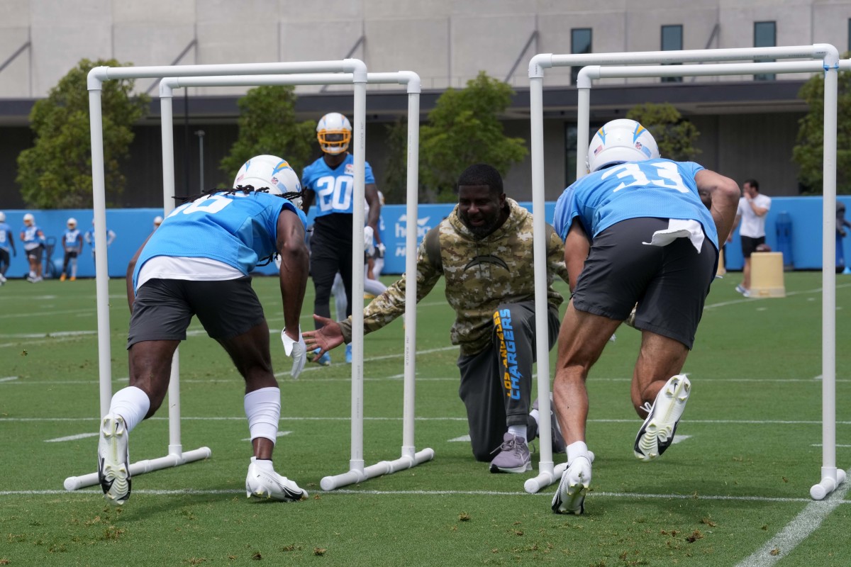 Jun 14, 2022; Costa Mesa, California, USA; Los Angeles Chargers secondary coach secondary coach Derrick Ansley supervises defensive backs Deane Leonard (33) and Ja'Sir Taylor (36) during minicamp at the Hoag Performance Center. Mandatory Credit: Kirby Lee-USA TODAY Sports
