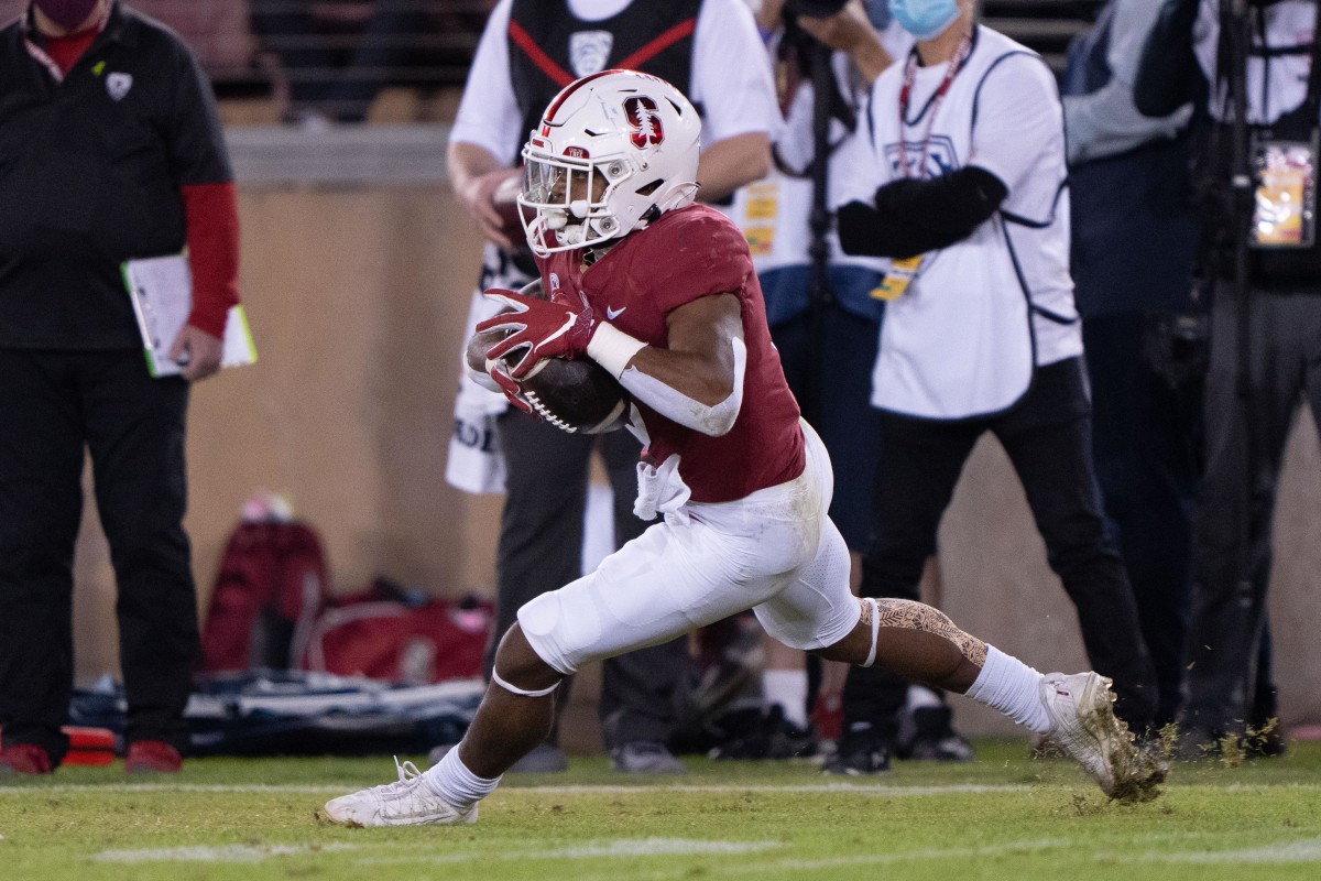 Nov 20, 2021; Stanford, California, USA; Stanford Cardinal running back Nathaniel Peat (8) runs with the football during the third quarter against the California Golden Bears at Stanford Stadium. Mandatory Credit: Stan Szeto-USA TODAY Sports