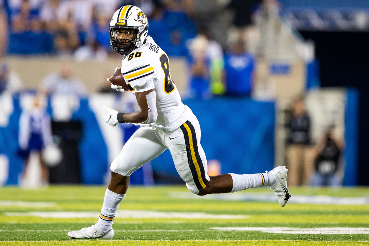 Sep 11, 2021; Lexington, Kentucky, USA; Missouri Tigers wide receiver Tauskie Dove (86) carries the ball for a 23 yard gain during the fourth quarter against the Kentucky Wildcats at Kroger Field. Mandatory Credit: Jordan Prather-USA TODAY Sports