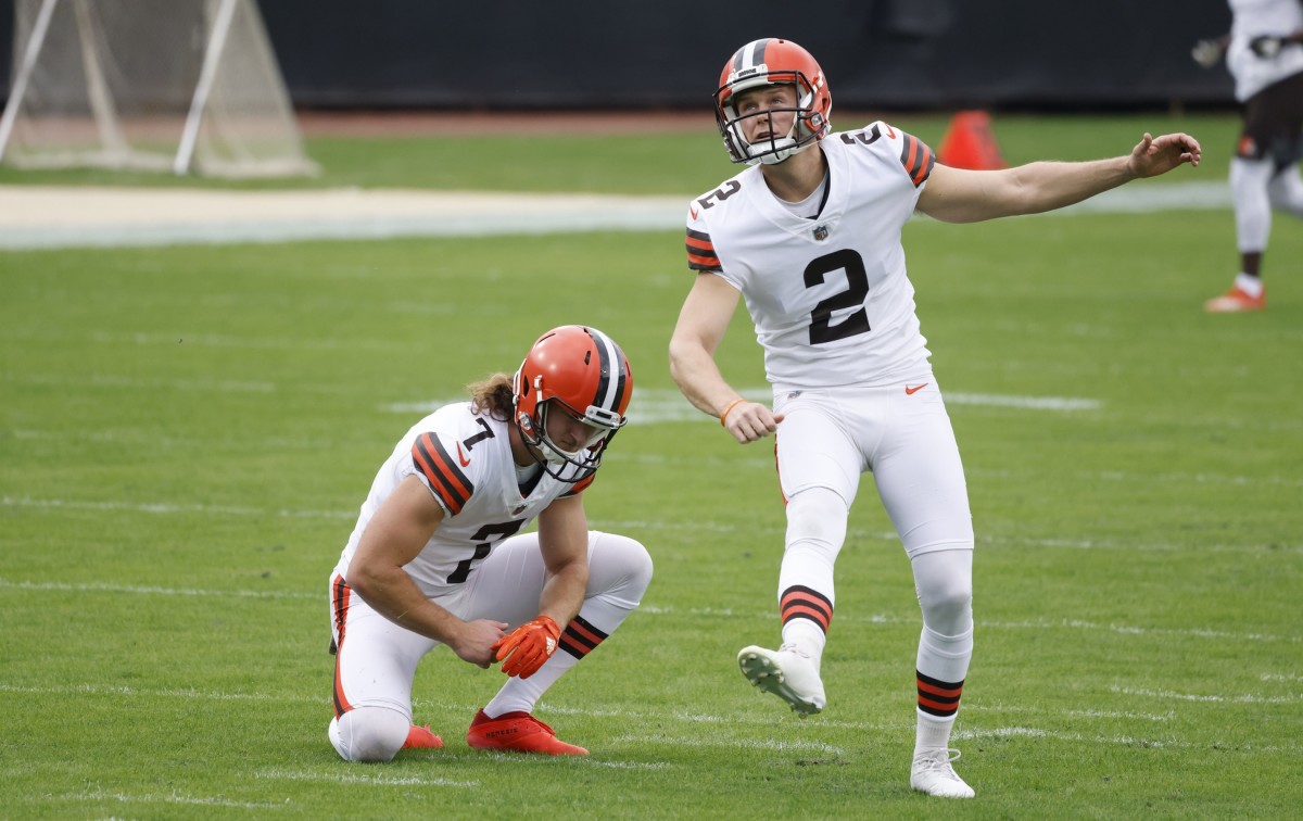 Nov 29, 2020; Jacksonville, Florida, USA; Cleveland Browns kicker Cody Parkey (2) kicks a field goal from the hold of punter Jamie Gillan (7) during warmups before a game against the Jacksonville Jaguars at TIAA Bank Field.
