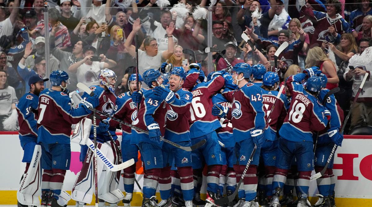 The Colorado Avalanche celebrate after an overtime win over Tampa Bay Lightning in Game 1 of the NHL hockey Stanley Cup Final on Wednesday, June 15, 2022, in Denver.