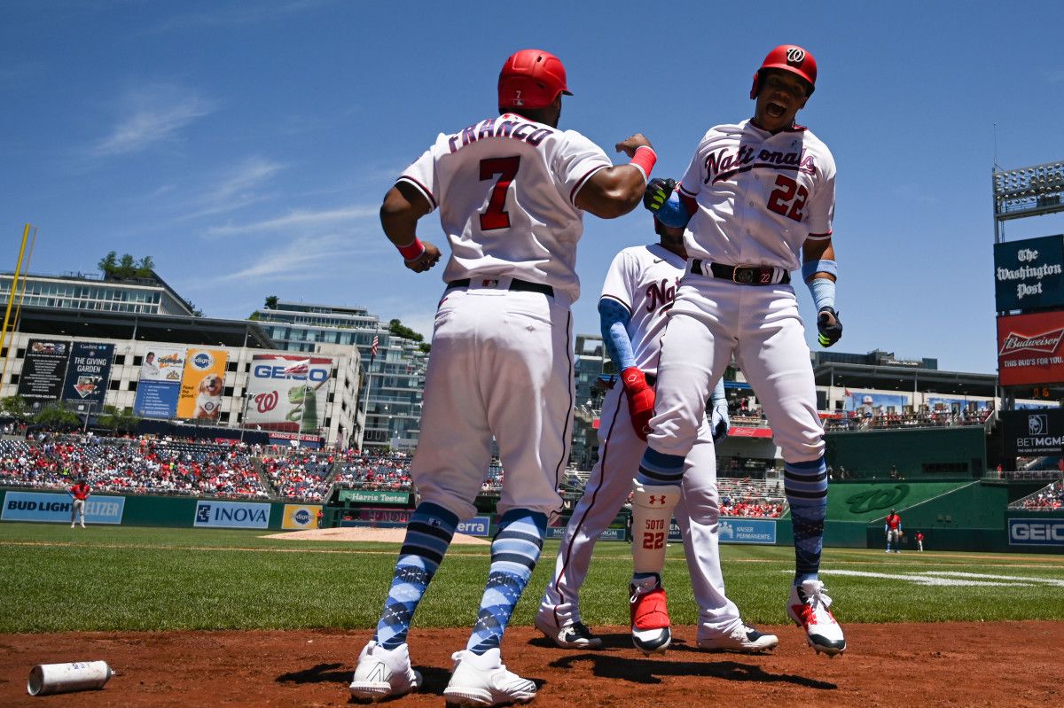 Juan Soto celebrates with Maikel Franco after hitting a three-run home run.