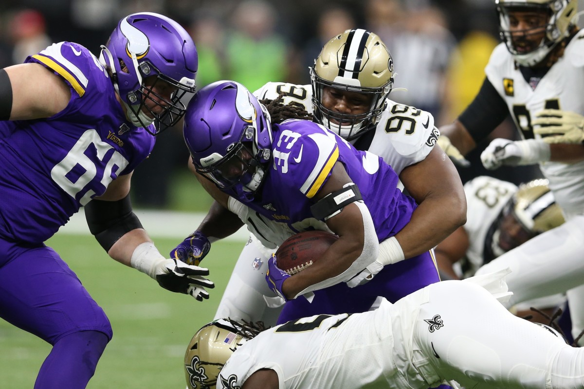 New Orleans Saints defensive tackle Shy Tuttle (99) tackles Minnesota Vikings running back Dalvin Cook (33). Mandatory Credit: Chuck Cook -USA TODAY Sports