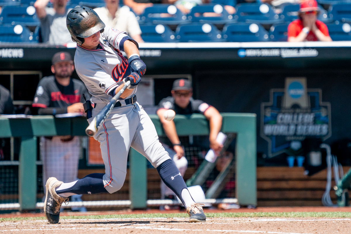 Jun 20, 2022; Omaha, NE, USA; Auburn Tigers shortstop Brody Moore (4) hits a single against the Stanford Cardinal during the fourth inning at Charles Schwab Field. Mandatory Credit: Dylan Widger-USA TODAY Sports