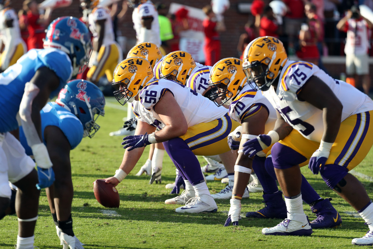 Oct 23, 2021; Oxford, Mississippi, USA; LSU Tigers offensive linemen Liam Shanahan (56) and the offensive line prepare for the snap during the second half against the Mississippi Rebels at Vaught-Hemingway Stadium. Mandatory Credit: Petre Thomas-USA TODAY Sports