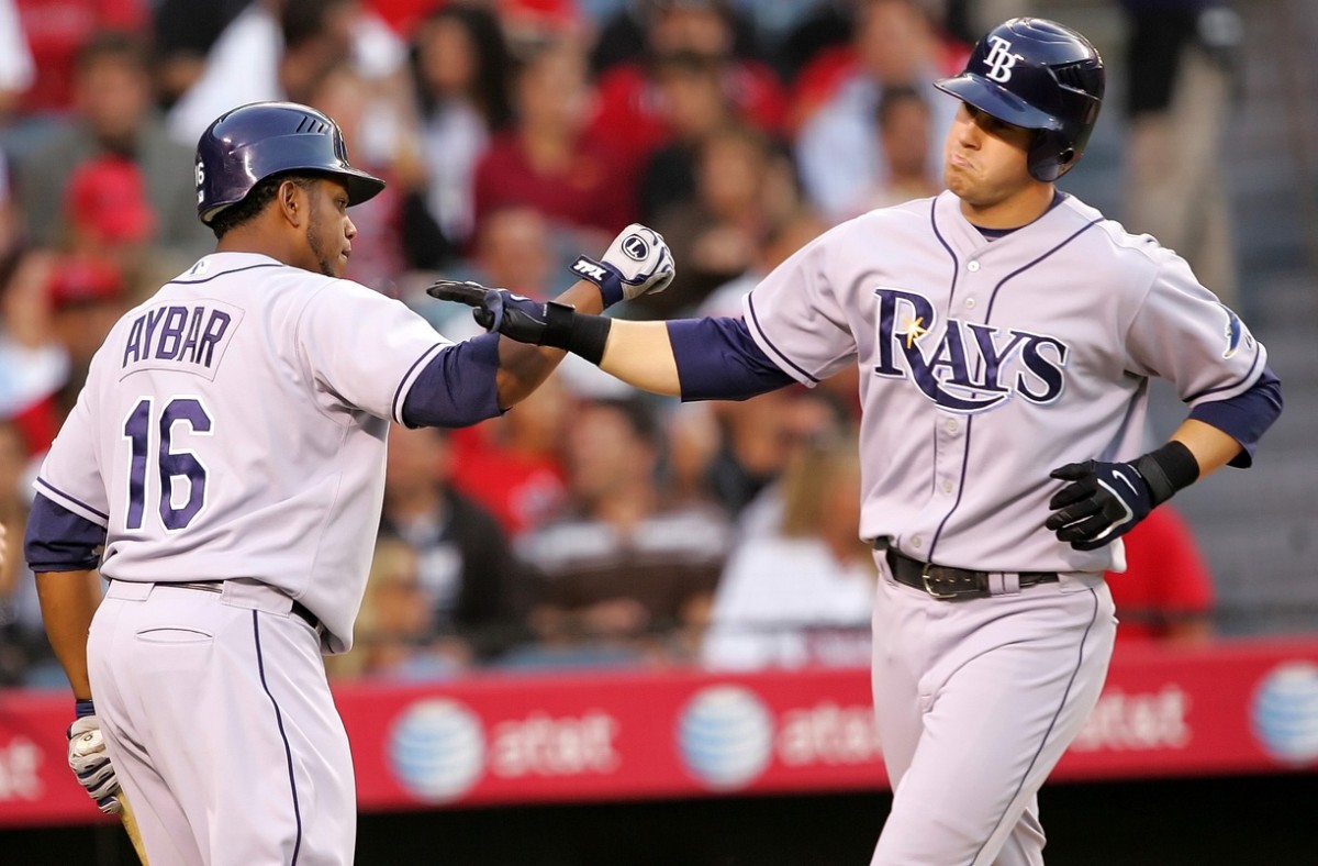 Tampa Bay's Willy Aybar (16) congratulates third baseman Evan Longoria (right) after he hit a home run  (Gary A. Vasquez-USA TODAY Sports)