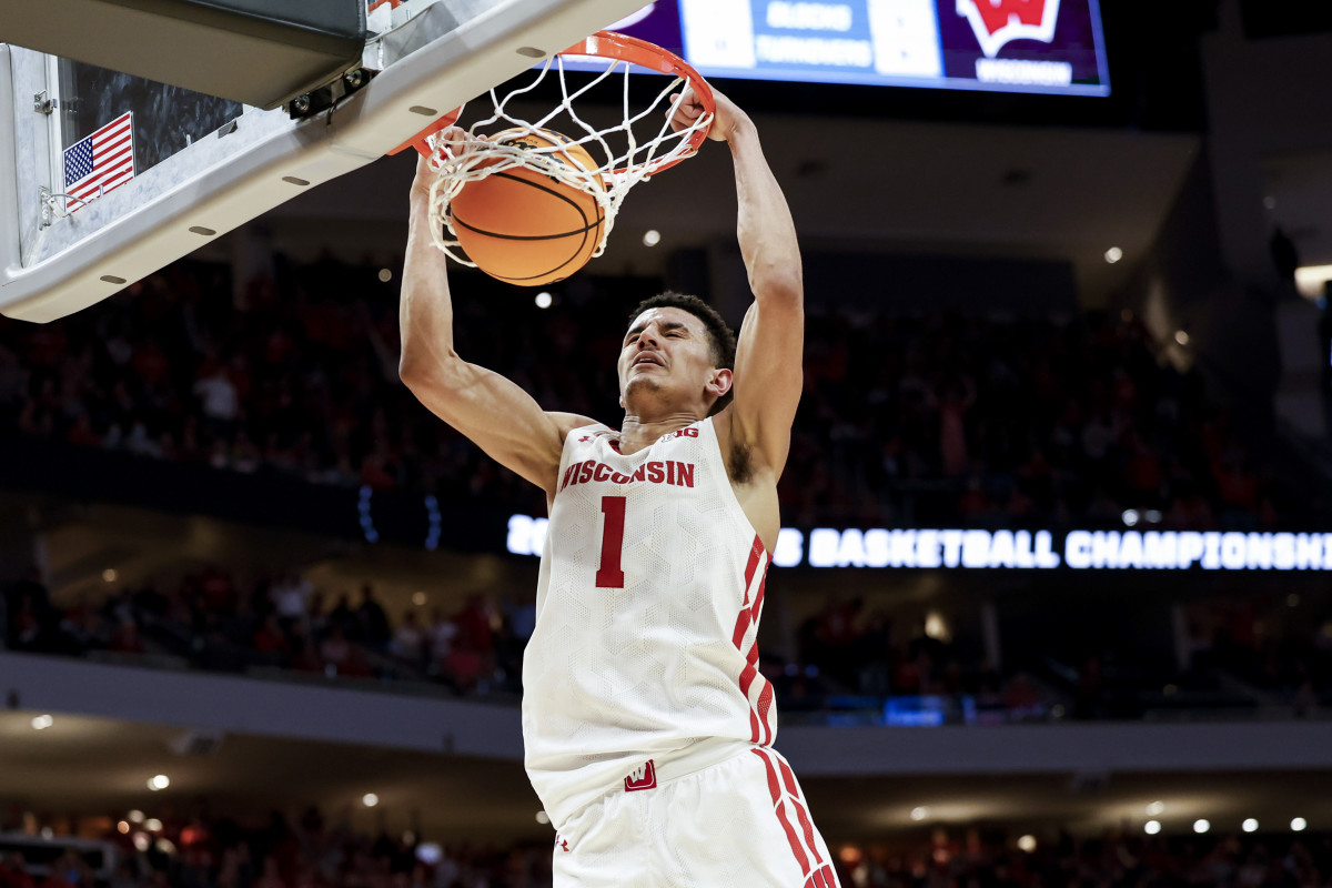 Wisconsin Badgers guard Johnny Davis (1) dunks the ball against the Colgate Raiders in the second half during the second round of the 2022 NCAA Tournament at Fiserv Forum.