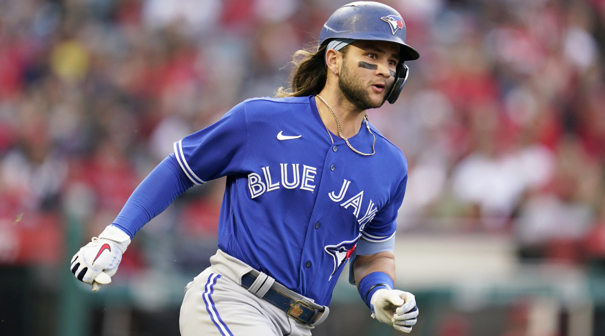 Toronto Blue Jays’ Bo Bichette (11) runs to second base on a ground-rule double during the second inning of a baseball game against the Los Angeles Angels in Anaheim, Calif., Friday, May 27, 2022.