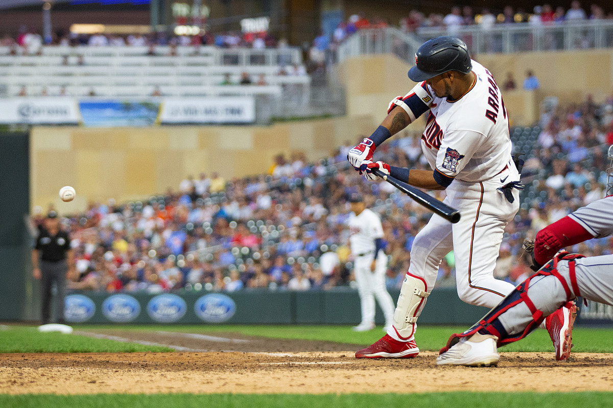 Minnesota Twins Luis Arraez swings into a three-run homer against the Cleveland Guardians in the seventh inning of a baseball game Tuesday, June 21, 2022, in Minneapolis.