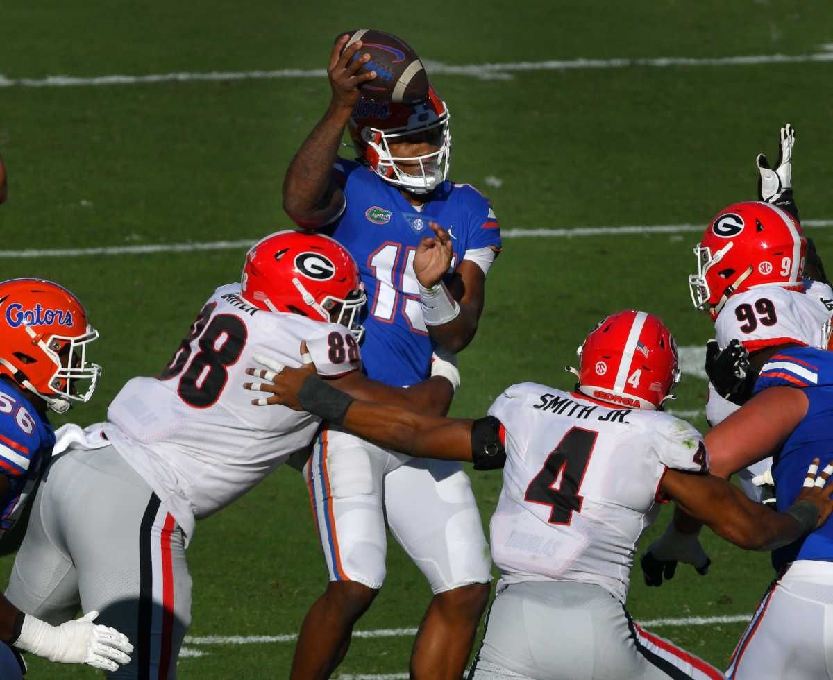 Georgia Bulldogs defensive lineman Jalen Carter (88) puts a hit on Florida Gators quarterback Anthony Richardson (15) during first quarter action. The Florida Gators went into the half trailing the Georgia Bulldogs 24 to 0. The Florida Gators were the home team for this years annual Florida vs Georgia college football rivalry game at TIAA Bank field in Jacksonville, Florida Saturday, October 30, 2021. [Bob Self/Florida Times-Union] Jki 103021 Bsfloridageorgia 17