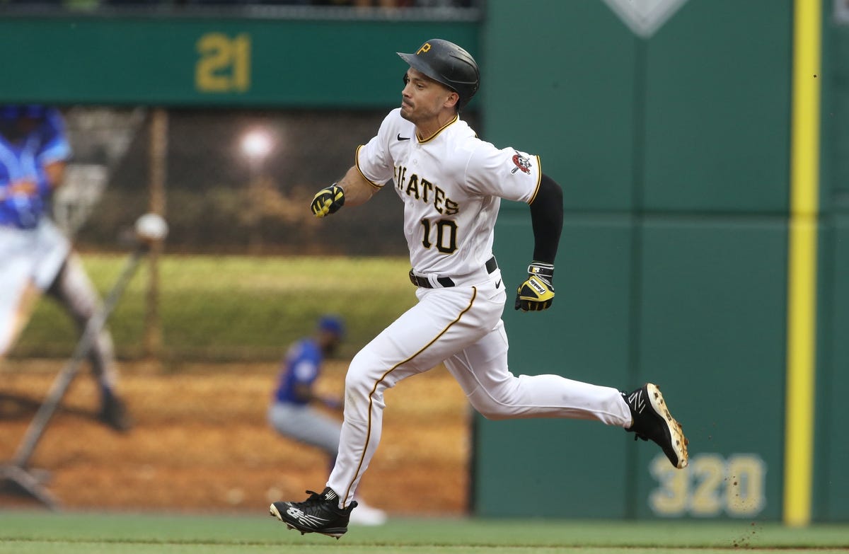 Jun 22, 2022; Pittsburgh, Pennsylvania, USA; Pittsburgh Pirates center fielder Bryan Reynolds (10) runs too third base after hitting a triple against the Chicago Cubs during the first inning at PNC Park. Mandatory Credit: Charles LeClaire-USA TODAY Sports