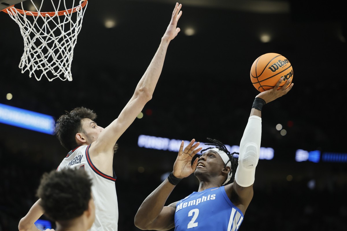 Mar 19, 2022; Portland, OR, USA; Memphis Tigers center Jalen Duren (2) shoots the ball against Gonzaga Bulldogs center Chet Holmgren (34) during the first half in the second round of the 2022 NCAA Tournament at Moda Center. Mandatory Credit: Soobum Im-USA TODAY Sports