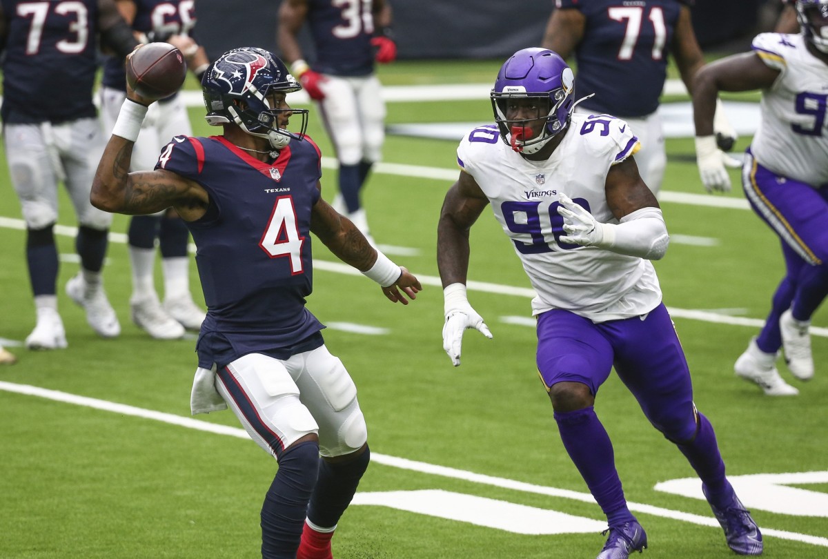 Oct 4, 2020; Houston, Texas, USA; Houston Texans quarterback Deshaun Watson (4) throws a pass against Minnesota Vikings defensive end Jalyn Holmes (90) during the third quarter at NRG Stadium.