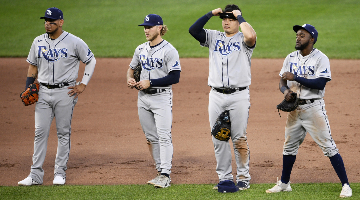 Tampa Bay Rays infielders Isaac Paredes, Taylor Walls, Ji-Man Choi and Vidal Brujan, from left, wait during a pitching change in the seventh inning of the team’s baseball game against the Baltimore Orioles, Friday, June 17, 2022, in Baltimore. The Orioles won 1-0.