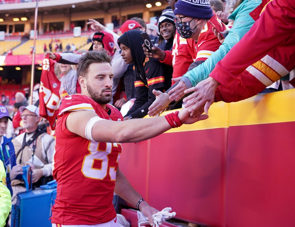 Dec 12, 2021; Kansas City, Missouri, USA; Kansas City Chiefs tight end Noah Gray (83) greets fans while leaving the field after the win over the Las Vegas Raiders at GEHA Field at Arrowhead Stadium. Mandatory Credit: Denny Medley-USA TODAY Sports