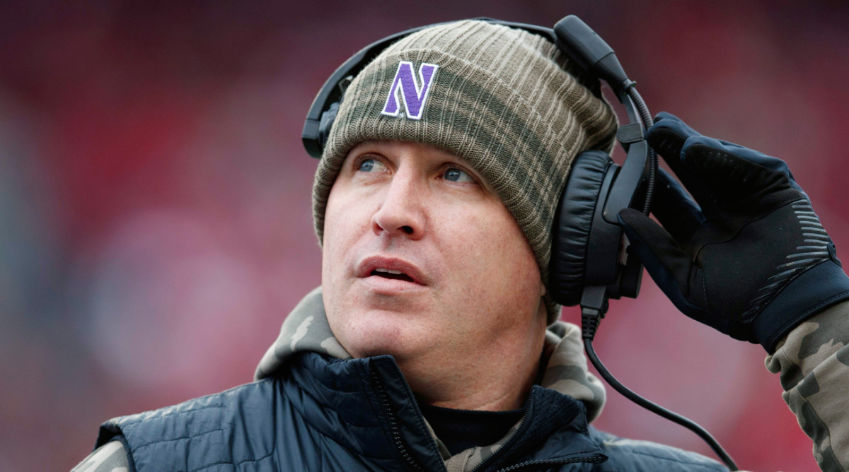 Northwestern Wildcats head coach Pat Fitzgerald looks to the scoreboard.