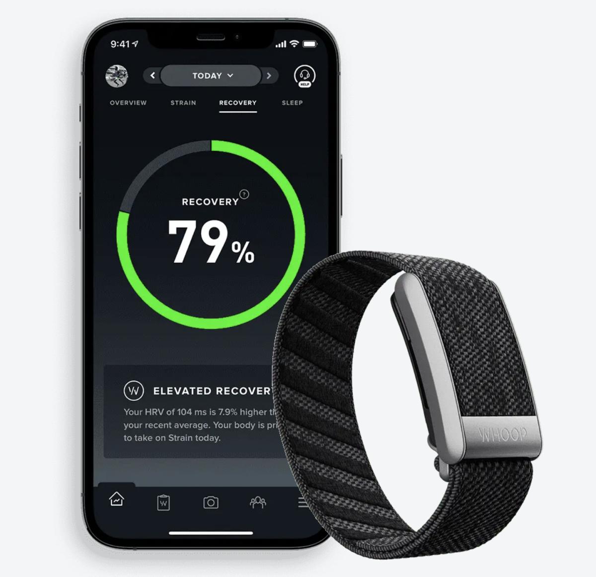 A phone with the WHOOP 4.0 app open next to the WHOOP wristband