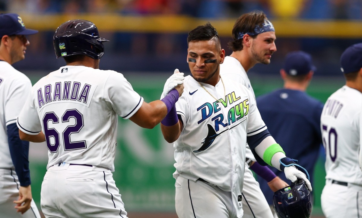 Tampa Bay Rays infielder Isaac Paredes (17) is congratulated after hitting a walk off single against the Pittsburgh Pirates in the ninth inning at Tropicana Field. (Nathan Ray Seebeck-USA TODAY Sports)