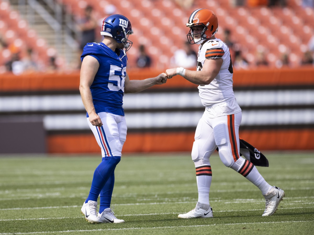 Aug 22, 2021; Cleveland, Ohio, USA; New York Giants long snapper Casey Kreiter (58) and Cleveland Browns long snapper Charley Hughlett (47) bump fists during warmups before the game at FirstEnergy Stadium.