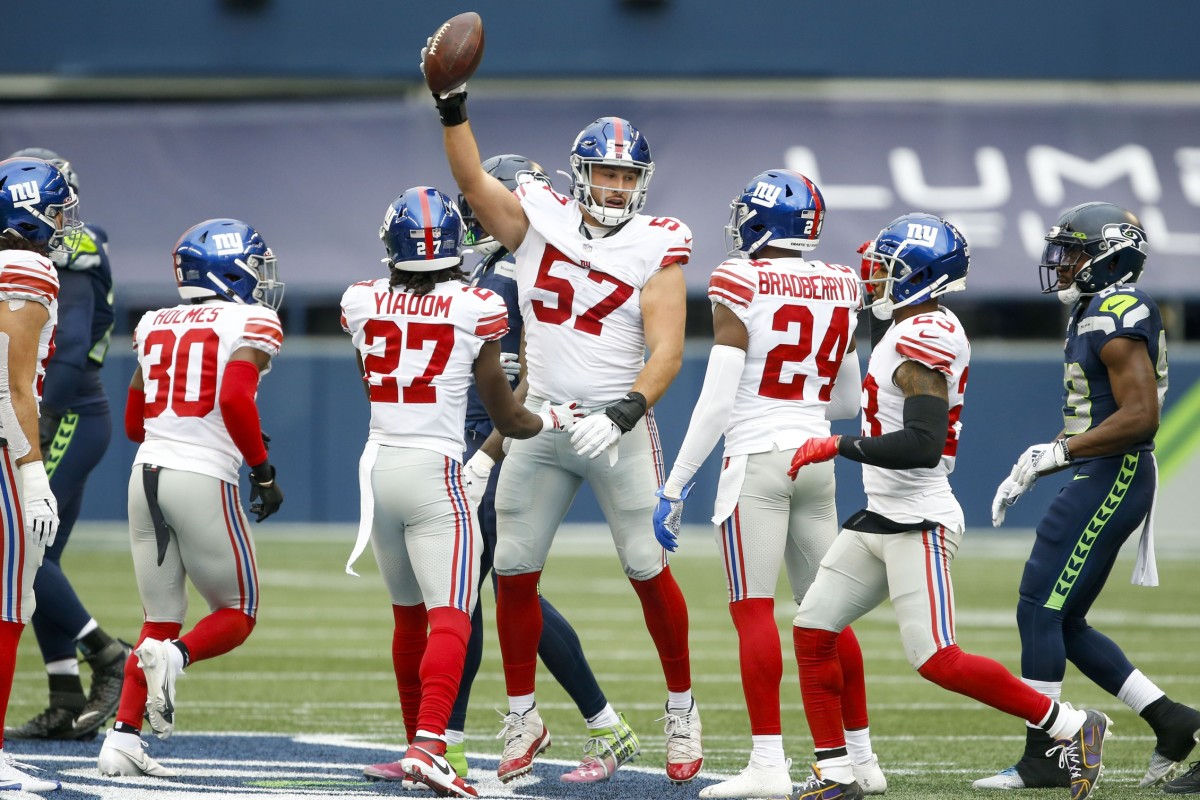 Dec 6, 2020; Seattle, Washington, USA; New York Giants defensive end Niko Lalos (57) reacts after recovering a fumble against the Seattle Seahawks during the second quarter at Lumen Field.