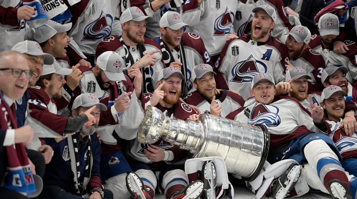 The Colorado Avalanche pose with the Stanley Cup after defeating the Tampa Bay Lightning 2-1 in Game 6 of the NHL hockey Stanley Cup Finals on Sunday, June 26, 2022, in Tampa, Fla.