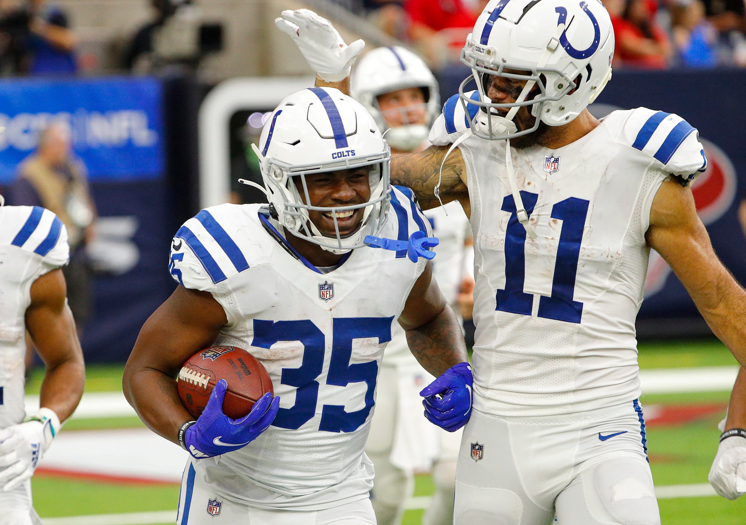 Indianapolis Colts running back Deon Jackson (35) is congratulated by wide receiver Michael Pittman (11) after Jackson scored a touchdown during the fourth quarter of the game Sunday, Dec. 5, 2021, at NRG Stadium in Houston. Indianapolis Colts Versus Houston Texans On Sunday Dec 5 2021 At Nrg Stadium In Houston Texas