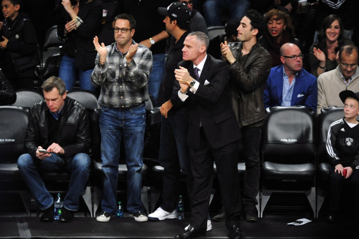 May 4, 2013; Brooklyn, NY, USA; Brooklyn Nets CEO Brett Yormark (center) cheers against the Chicago Bulls during the second half in game seven of the first round of the 2013 NBA Playoffs at the Barclays Center. The Bulls won 99-93.