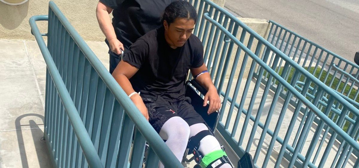 Kyngstonn Viliamu-Asa gets wheeled out with his knee injury.