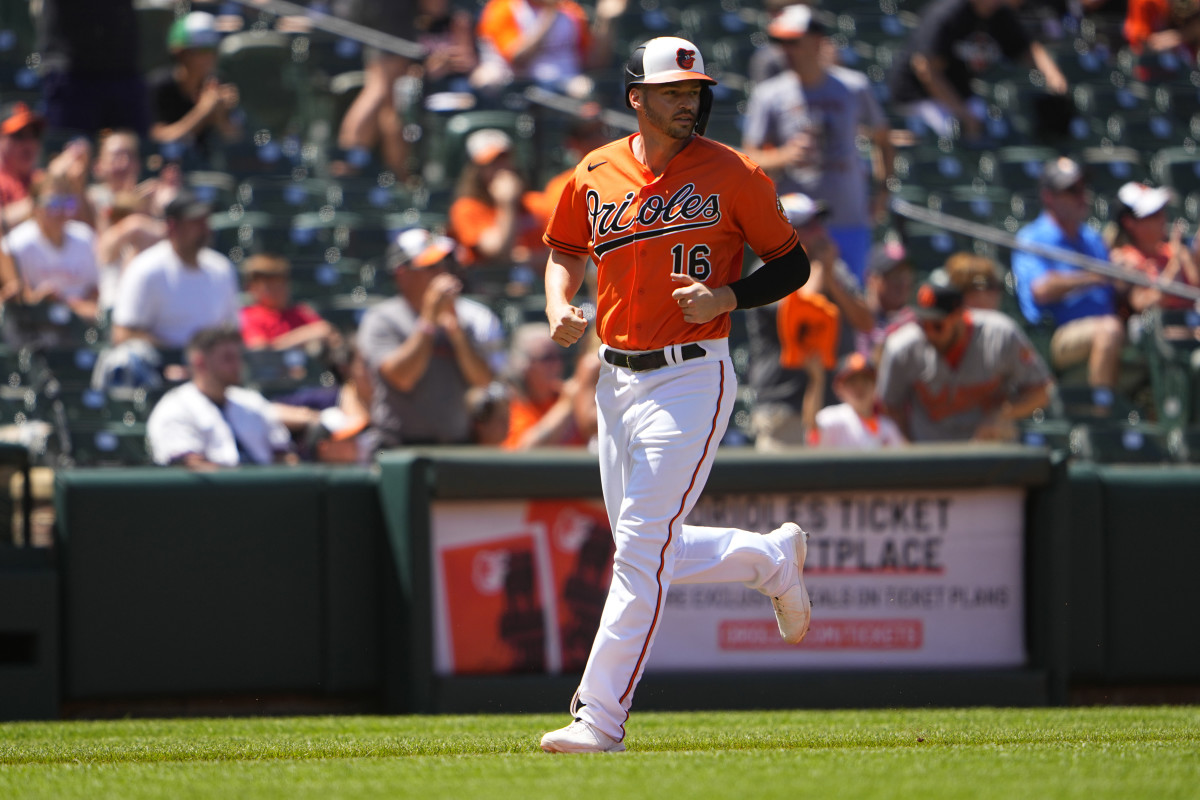 Jun 5, 2022; Baltimore, Maryland, USA; Baltimore Orioles designated hitter Trey Mancini (16) scores a run on Baltimore Orioles first baseman Ryan Mountcastle (6) (not pictured) two run home run against the Cleveland Guardians during the fourth inning at Oriole Park at Camden Yards.