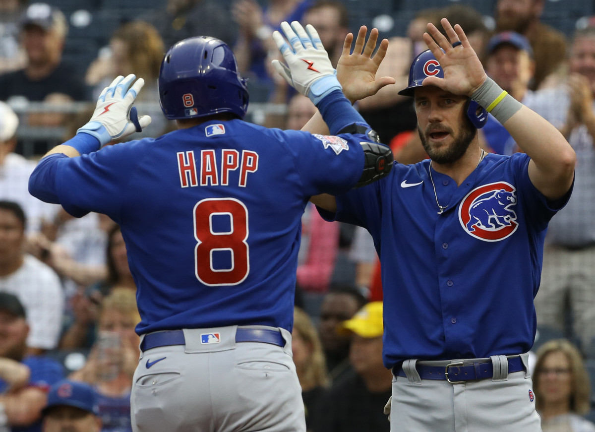 Jun 22, 2022; Pittsburgh, Pennsylvania, USA; Chicago Cubs third baseman Patrick Wisdom (right) congratulates left fielder Ian Happ (8) on his two-run home run against the Pittsburgh Pirates during the second inning at PNC Park.