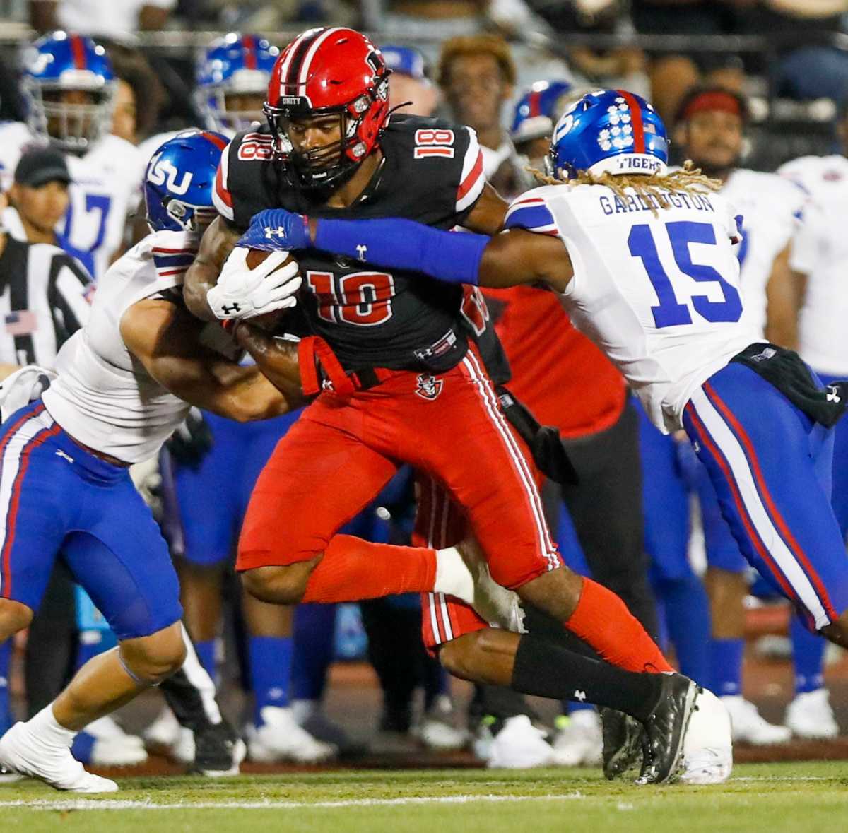 Austin Peay Governors wide receiver Joshua DeCambre (18) pushes through a group of Tennessee State Tigers in an OVC football game between the Austin Peay Governors and Tennessee State Tigers at Fortera Stadium in Clarksville, Tenn., on Saturday, Oct. 2, 2021.