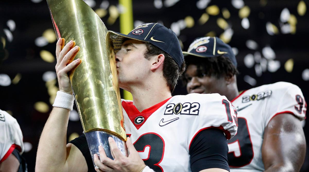 Georgia quarterback Stetson Bennett (13) kisses the trophy after winning the College Football Playoff National Championship on Jan. 10 at Lucas Oil Stadium in Indianapolis.