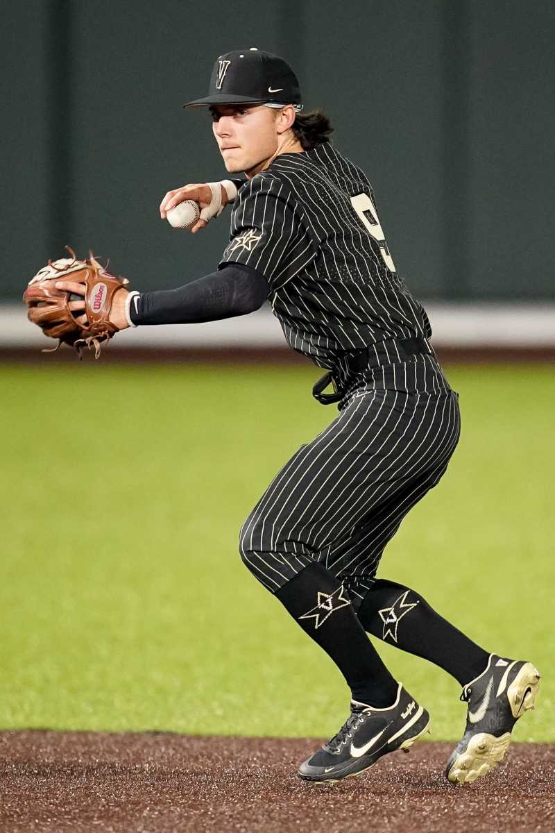 Vanderbilt shortstop Carter Young (9) fields a ground ball. 
