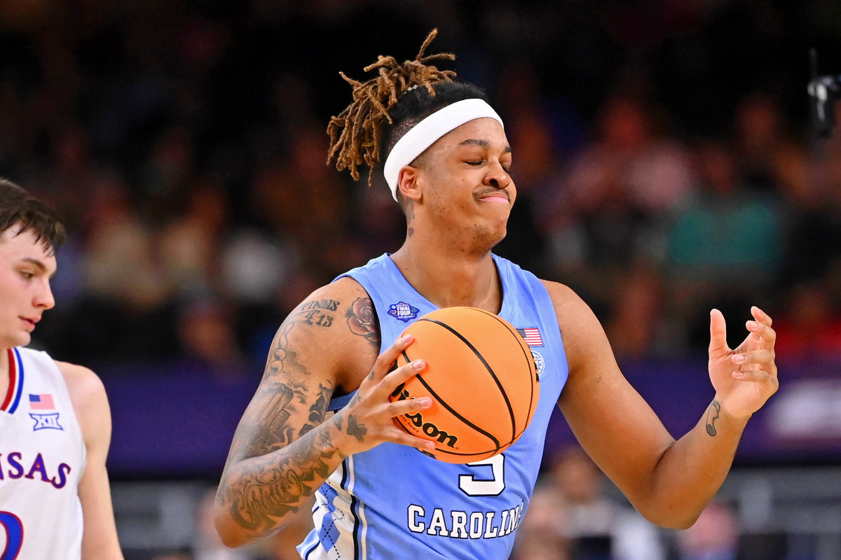 North Carolina Tar Heels forward Armando Bacot (5) reacts after a play against the Kansas Jayhawks during the first half during the 2022 NCAA men's basketball tournament Final Four championship game at Caesars Superdome.