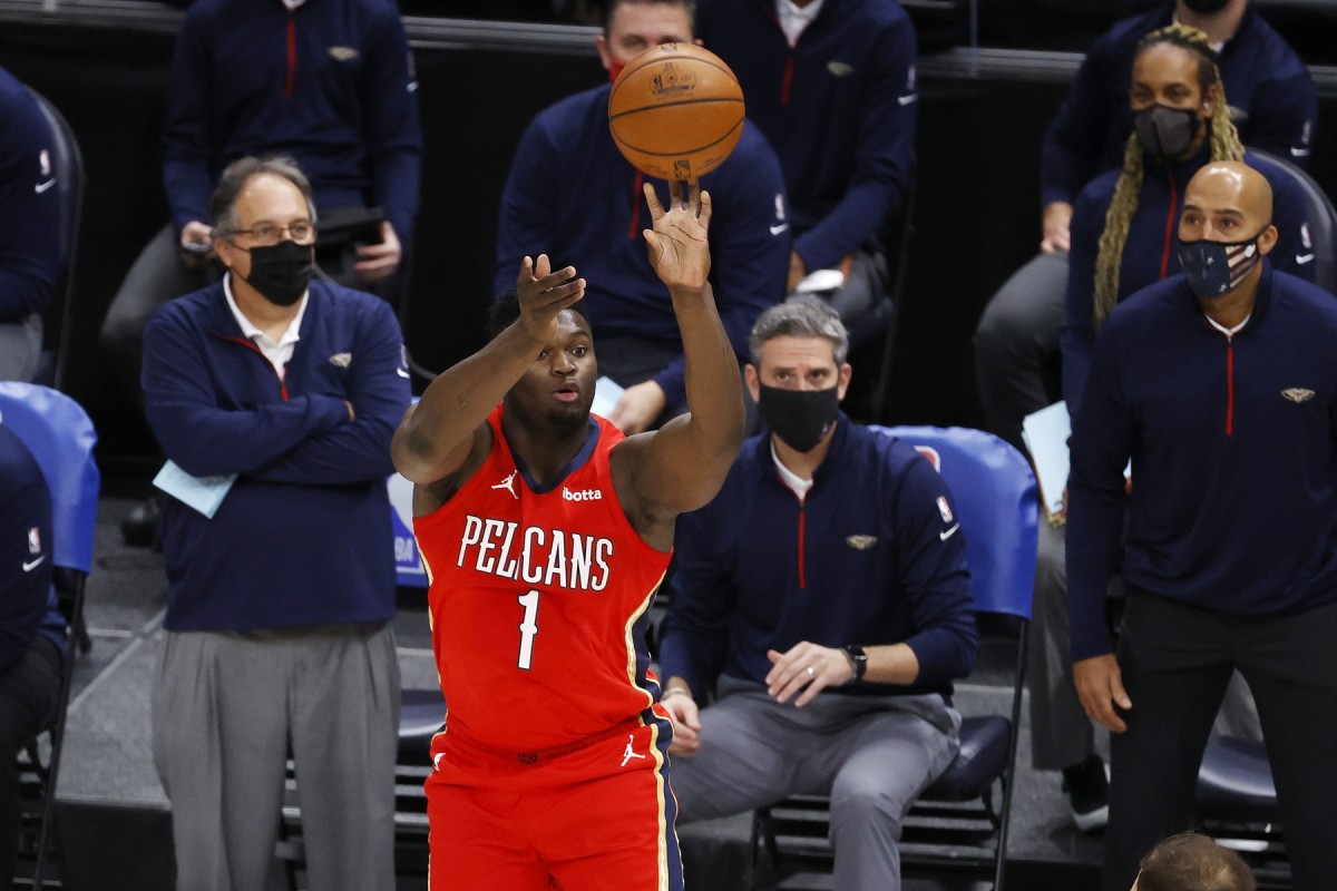 Jan 21, 2021; Salt Lake City, Utah, USA; New Orleans Pelicans forward Zion Williamson (1) shoots for the three points in the first quarter against the Utah Jazz at Vivint Smart Home Arena. Mandatory Credit: Jeffrey Swinger-USA TODAY Sports