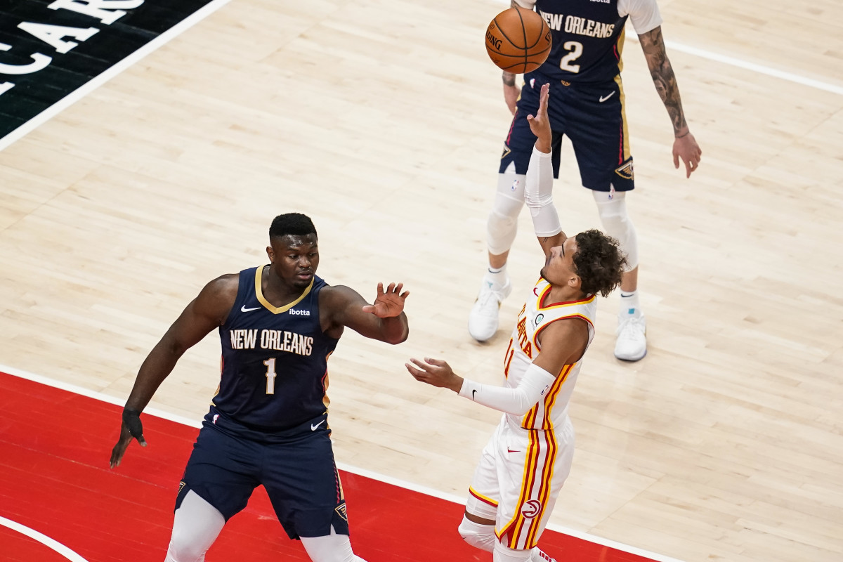 Atlanta Hawks guard Trae Young (11) shoots over New Orleans Pelicans forward Zion Williamson (1) during the first quarter at State Farm Arena.