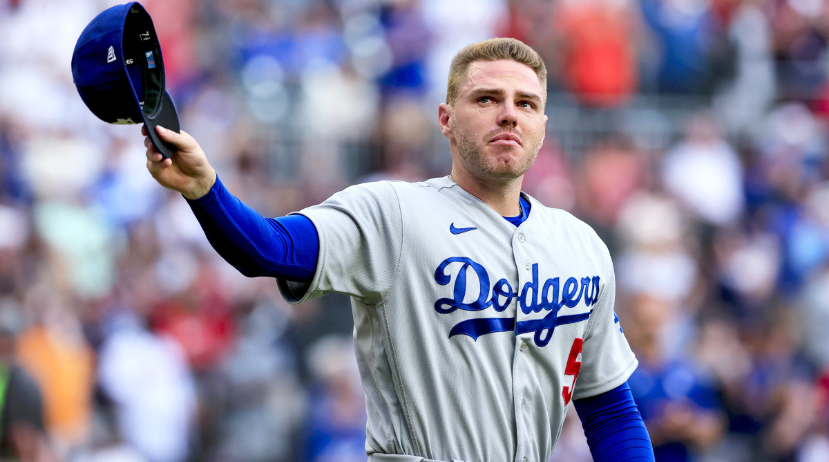Los Angeles Dodgers first baseman Freddie Freeman walks to the field for the presentation of his World Series championship ring, before the team’s baseball game against the Atlanta Braves on Friday, June 24, 2022 in Atlanta.