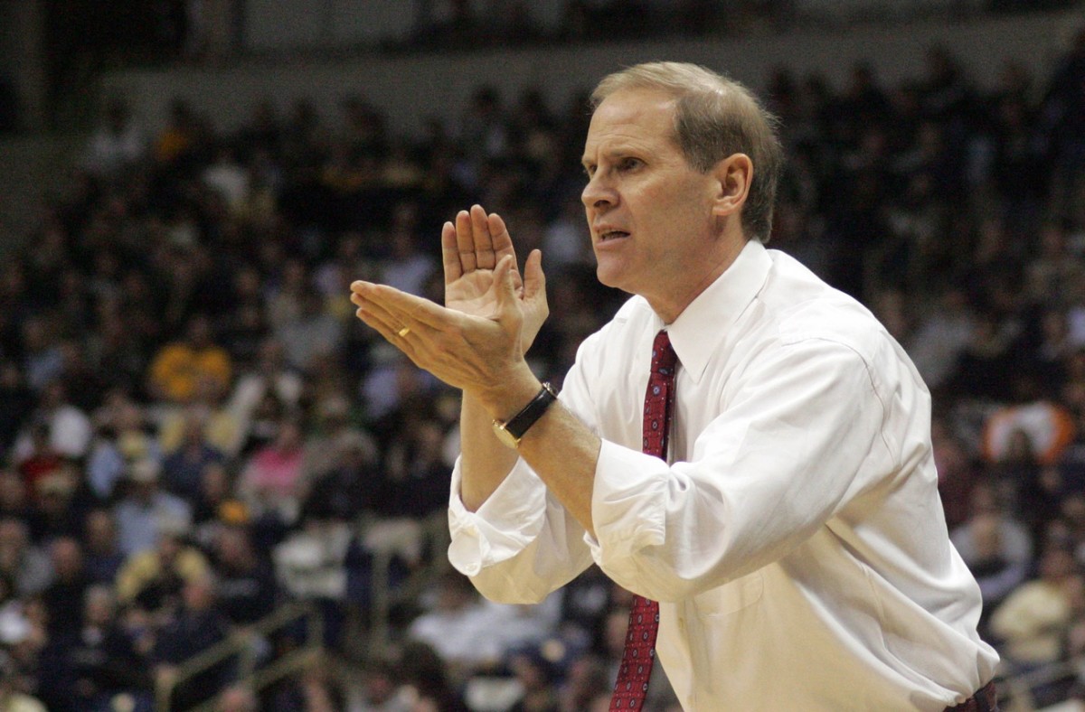 Feb 27, 2007; Pittsburgh, PA, USA; West Virginia Mountaineers head coach John Beilein congratulates his team on a play in the first half against the Pittsburgh Panthers at the Petersen Events Center in Pittsburgh, PA.