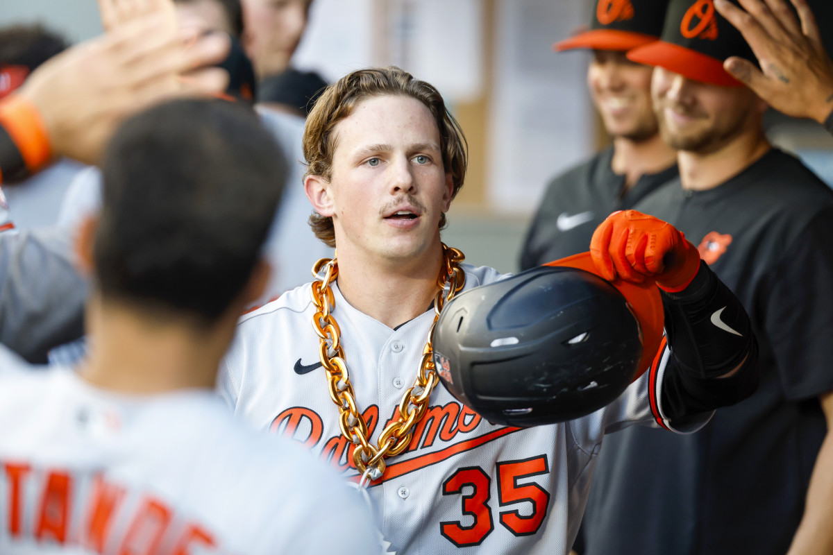 Jun 27, 2022; Seattle, Washington, USA; Baltimore Orioles catcher Adley Rutschman (35) celebrates in the dugout  after hitting a solo-home run against the Seattle Mariners during the third inning at T-Mobile Park.