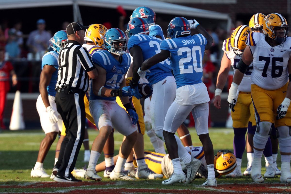 Oct 23, 2021; Oxford, Mississippi, USA; Mississippi Rebels linebacker Chance Campbell (44), linebacker Cedric Johnson (33) and defensive back Keidron Smith (20) celebrate a fumble recovery during the second half against the LSU Tigers at Vaught-Hemingway Stadium. Mandatory Credit: Petre Thomas-USA TODAY Sports