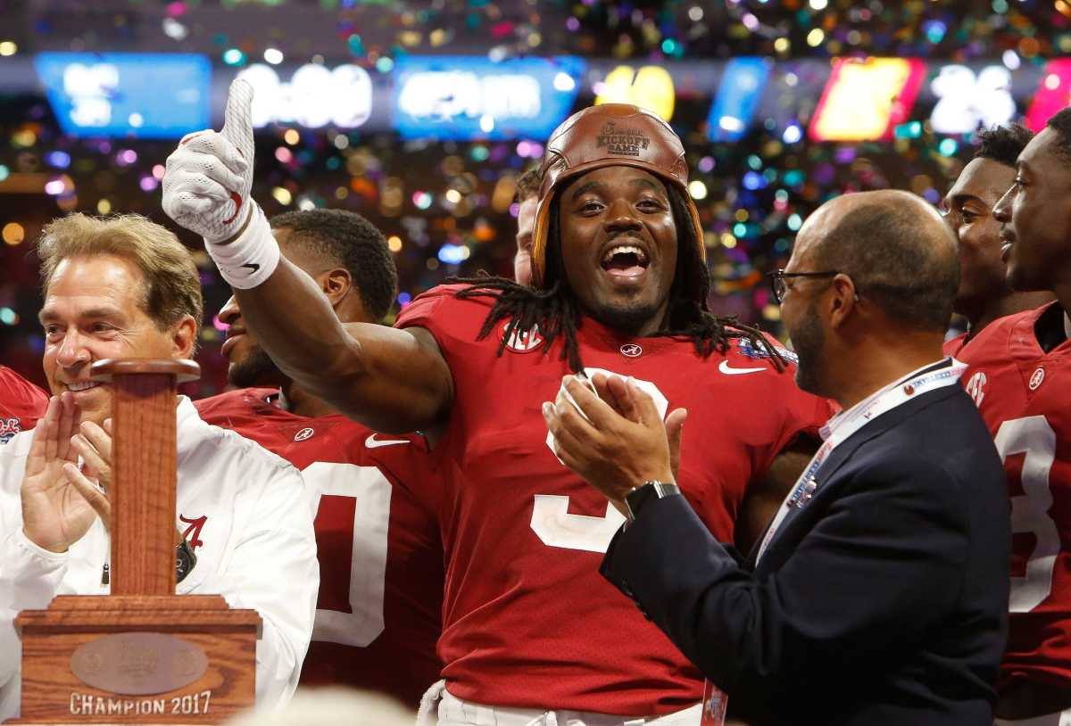 Alabama running back Bo Scarbrough (9) celebrates wearing the old leather helmet after Alabama defeated Florida State 24-7 in Mercedes-Benz Stadium in Atlanta Saturday, September 2, 2017. [Staff Photo/Gary Cosby Jr.] Alabama Vs Florida State