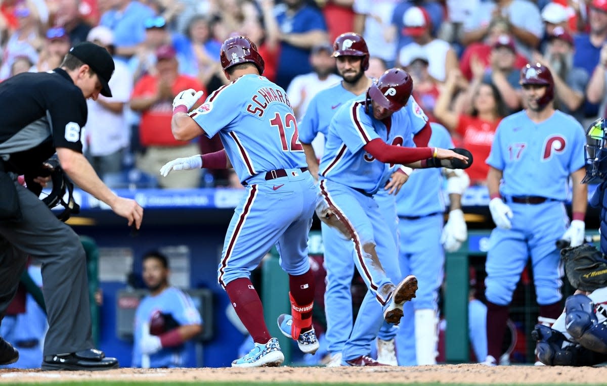 Jun 30, 2022; Philadelphia, Pennsylvania, USA; Philadelphia Phillies outfielder Kyle Schwarber (12) celebrates with infielder Bryson Stott (5) after hitting a three-run home run against the Atlanta Braves in the third inning at Citizens Bank Park. Mandatory Credit: Kyle Ross-USA TODAY Sports