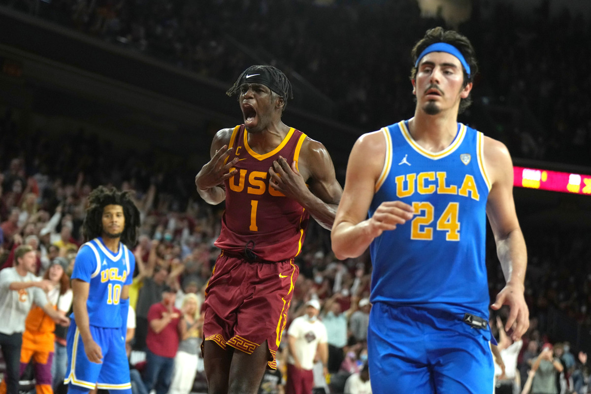 Feb 12, 2022; Los Angeles, California, USA; Southern California Trojans forward Chevez Goodwin (1) celebrates in the second half as UCLA Bruins guard Tyger Campbell (10) and guard Jaime Jaquez Jr. (24) look on at the Galen Center. Mandatory Credit: Kirby Lee-USA TODAY Sports