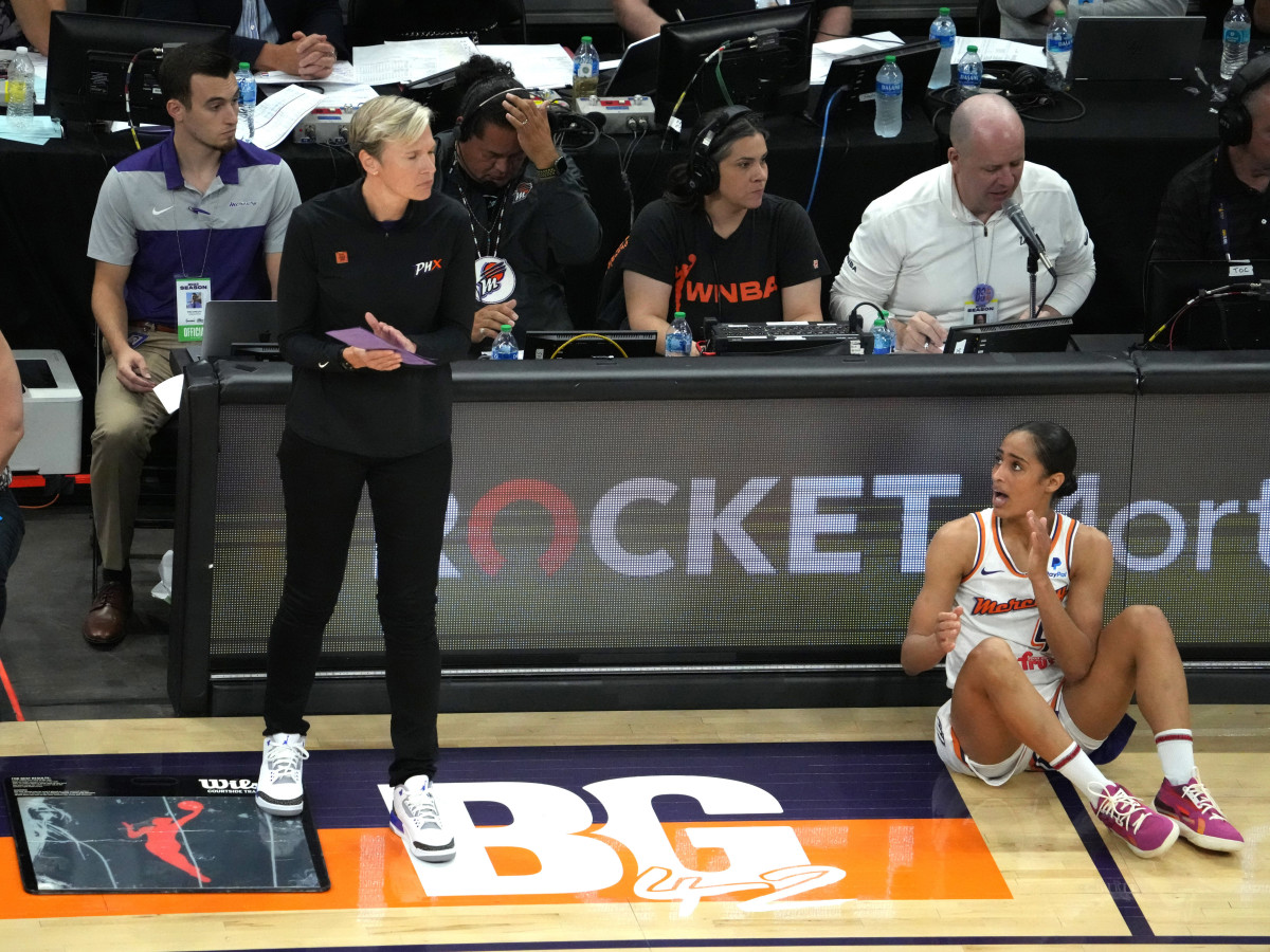 Phoenix Mercury head coach Vanessa Nygaard and guard Skylar Diggins-Smith near a painted section of the court reading BG 42 in support of Brittney Griner.