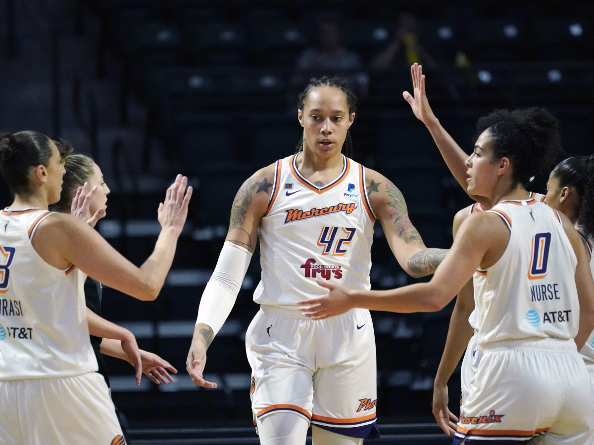 Phoenix Mercury’s Brittney Griner is congratulated by teammates in a game from 2021.