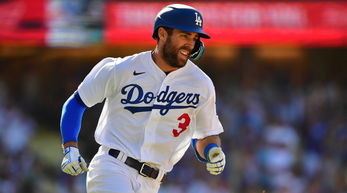 Los Angeles Dodgers left fielder Chris Taylor (3) runs after hitting a double against the New York Mets during the ninth inning at Dodger Stadium.