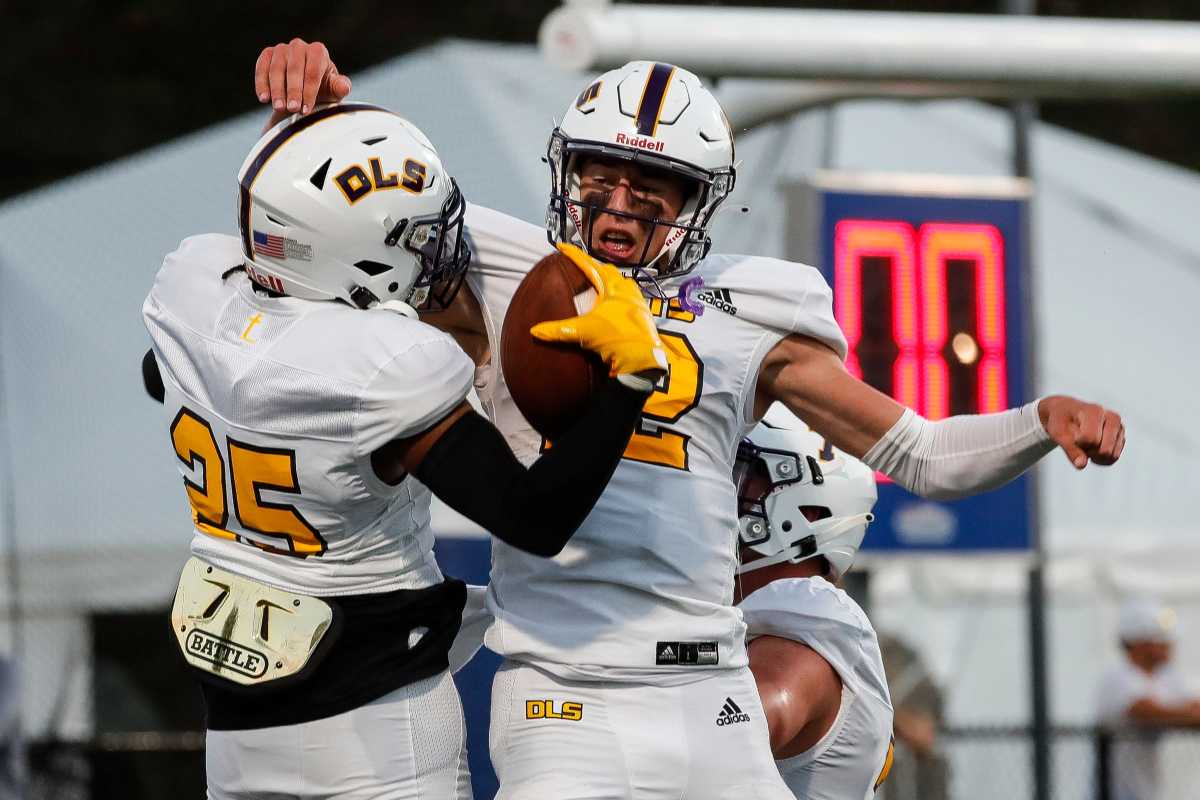 Warren De La Salle wide receiver Triston Nichols (25) celebrates a touchdown against Brother Rice with quarterback Brady Drogosh (12) during the first half at Lawrence Tech in Southfield on Friday, Sept. 17, 2021.