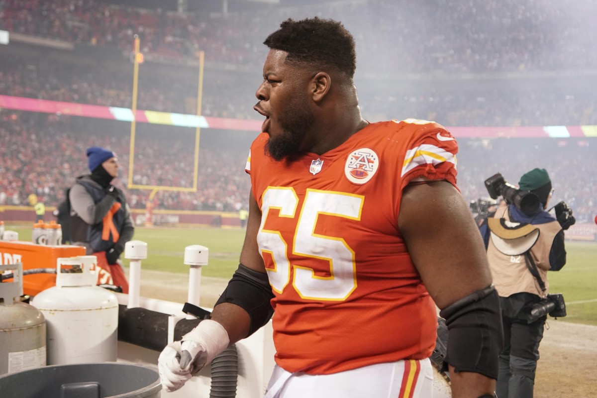 Jan 23, 2022; Kansas City, Missouri, USA; Kansas City Chiefs guard Trey Smith (65) celebrates while leaving the field after the win over the Buffalo Bills during an AFC Divisional playoff football game at GEHA Field at Arrowhead Stadium. Mandatory Credit: Denny Medley-USA TODAY Sports